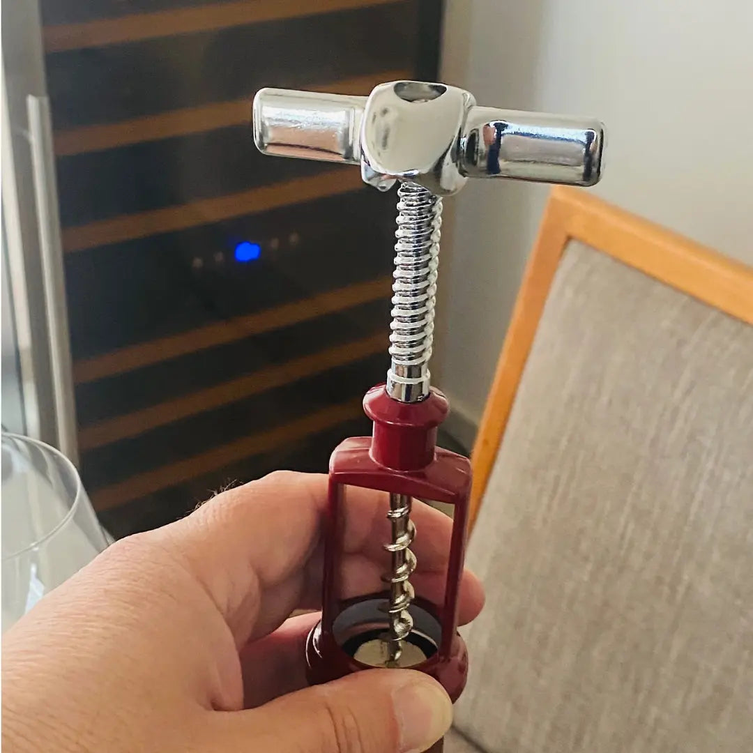 Sacacorchos articulado Ghidini fabricado en Italia, herramienta de alta calidad para abrir botellas de vino sin esfuerzo.