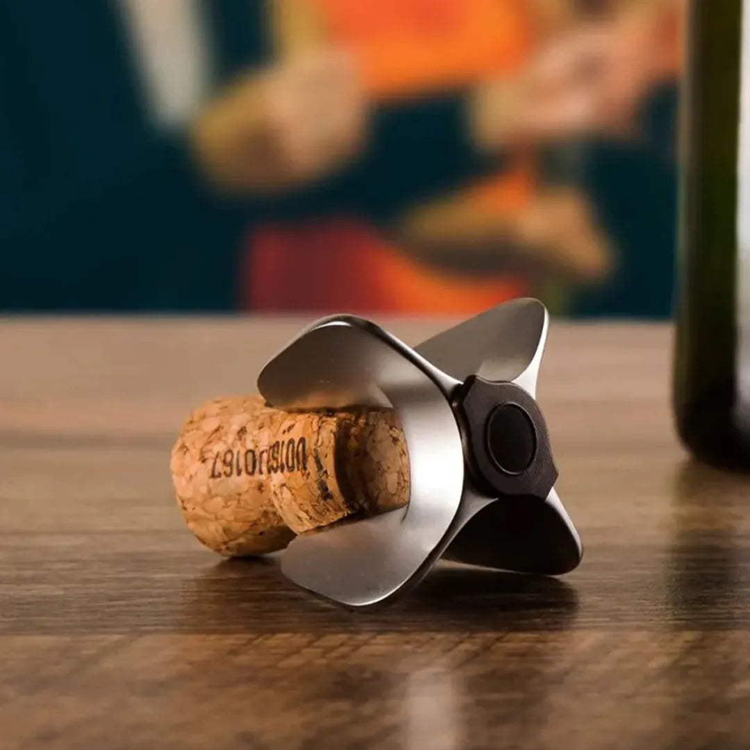 Abridor de champagne y espumantes de diseño elegante, ideal para abrir botellas con seguridad.