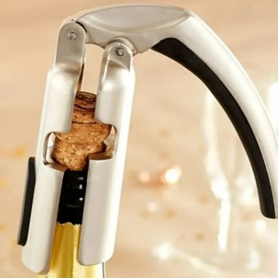 Abridor de espumantes tipo palanca en acero inoxidable, diseñado para abrir botellas con facilidad y seguridad.
