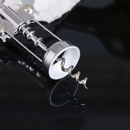 Descorchador de alas en acero de alta resistencia, ideal para abrir vinos tintos y blancos sin esfuerzo.