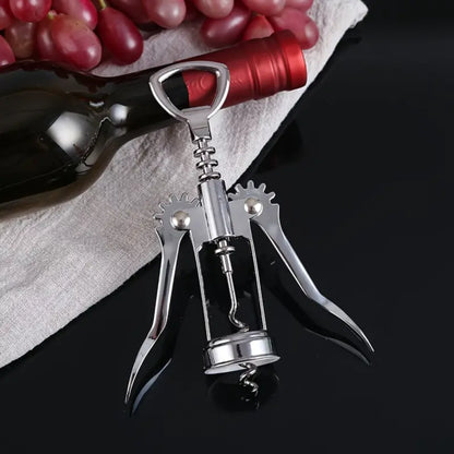 Sacacorchos de alas en acero inoxidable, diseño ergonómico para una apertura fácil y sin esfuerzo de botellas de vino.