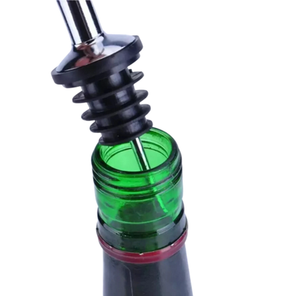 Vertedor dosificador de precisión para botellas de vino y licores, permite un control de flujo sin derrames.